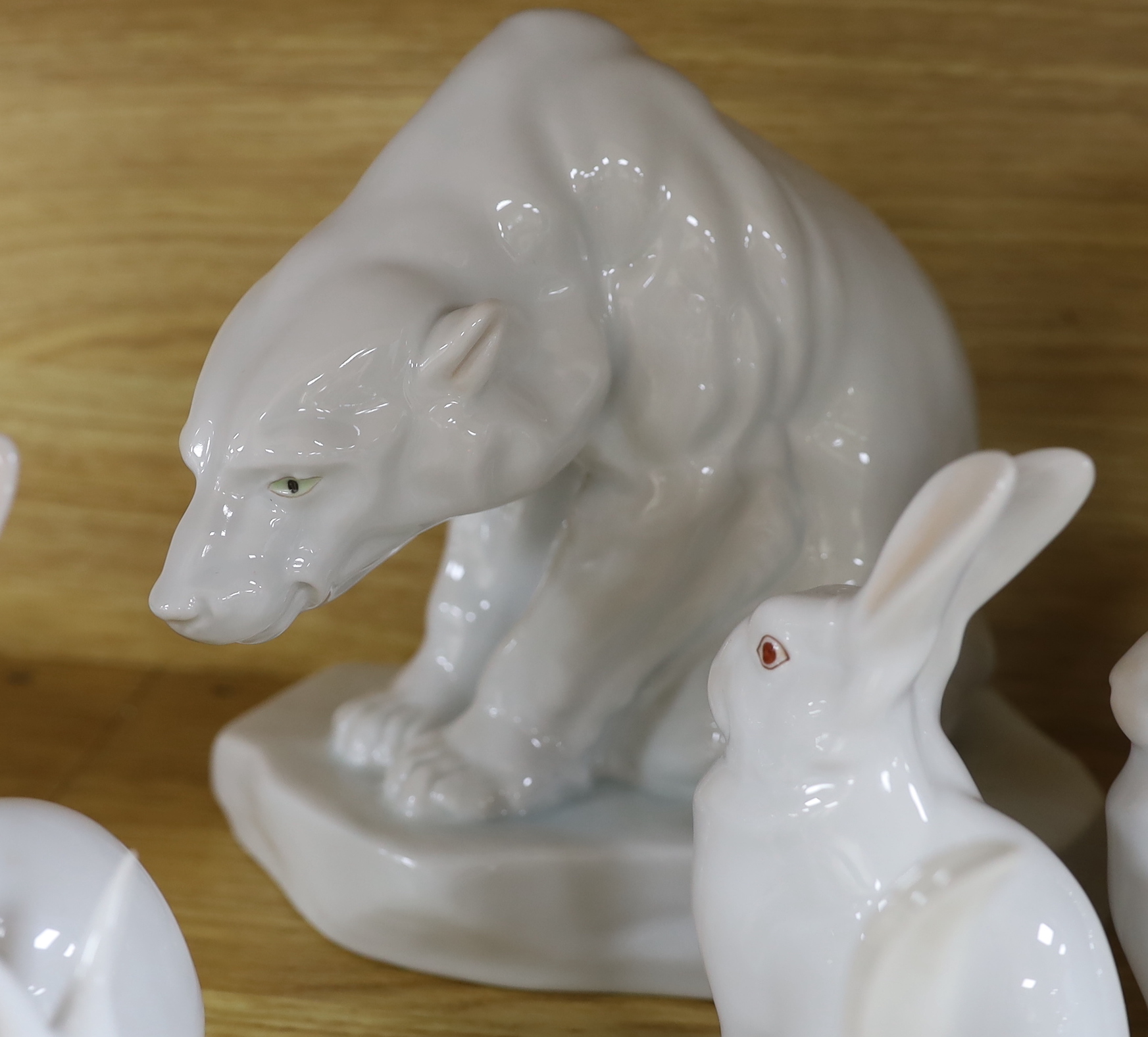 An Herend Polar bear and three sets of four graduated white glazed rabbits and a single green glazed rabbit, all by Herend Polar bear, 20cm high (14)